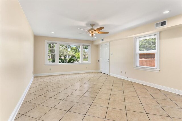 6141 Canal Blvd, New Orleans, LA 70124 - unfurnished room featuring healthy amount of natural light, light tile patterned flooring, a ceiling fan, baseboards, and recessed lighting