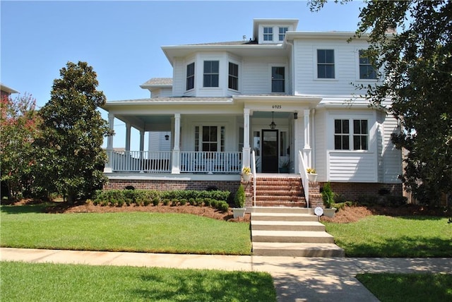 6925 Canal Blvd, New Orleans, LA 70124 - view of front of home featuring covered porch and a front lawn