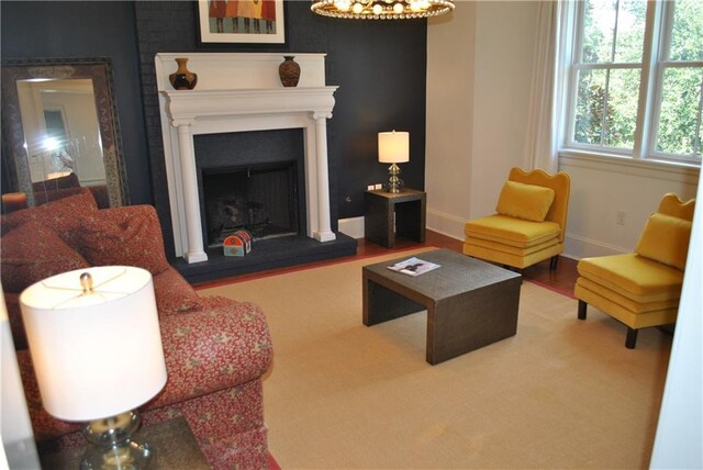 6925 Canal Blvd, New Orleans, LA 70124 - living area featuring a fireplace with raised hearth and wood finished floors