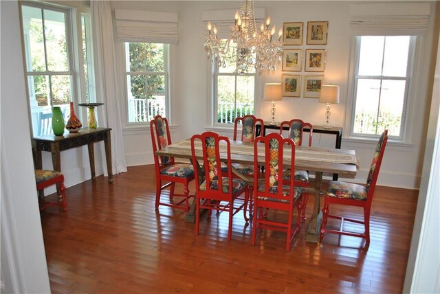6925 Canal Blvd, New Orleans, LA 70124 - living area featuring a chandelier and wood finished floors