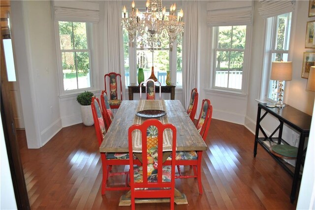 6925 Canal Blvd, New Orleans, LA 70124 - dining space featuring a chandelier, healthy amount of natural light, and wood finished floors
