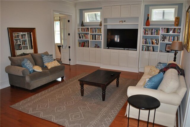 6925 Canal Blvd, New Orleans, LA 70124 - living area featuring wood finished floors, ornamental molding, plenty of natural light, and built in features