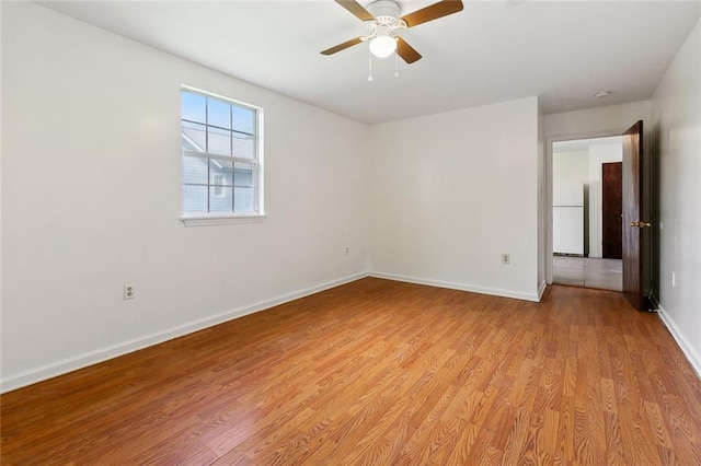 811 Tricou St, New Orleans, LA 70117 - empty room with baseboards, light wood-style floors, and ceiling fan