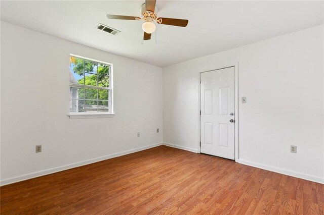 811 Tricou St, New Orleans, LA 70117 - spare room featuring light wood-type flooring, baseboards, and a ceiling fan
