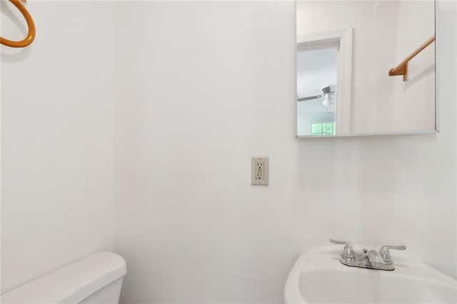 811 Tricou St, New Orleans, LA 70117 - bathroom featuring a sink and toilet