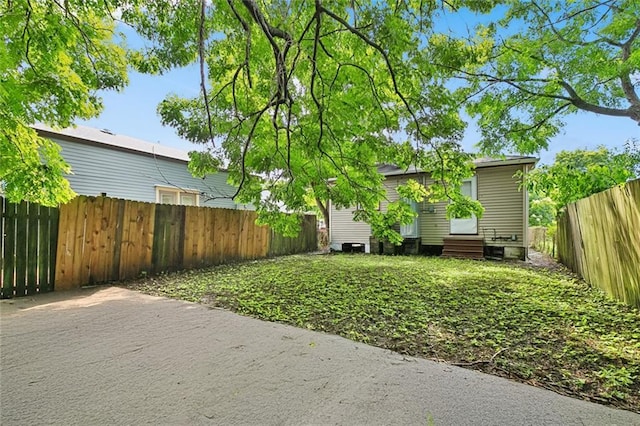 811 Tricou St, New Orleans, LA 70117 - fenced backyard featuring entry steps