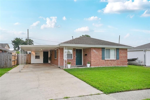 1517 Frankel Ave, Metairie, LA 70003 - view of front of house featuring driveway, brick siding, an attached carport, and roof with shingles