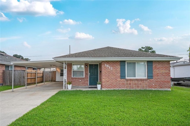 1517 Frankel Ave, Metairie, LA 70003 - view of front facade with brick siding, a carport, driveway, and roof with shingles