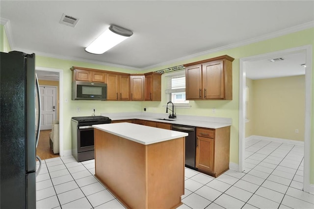 1517 Frankel Ave, Metairie, LA 70003 - kitchen featuring stainless steel appliances, light countertops, crown molding, a sink, and light tile patterned flooring