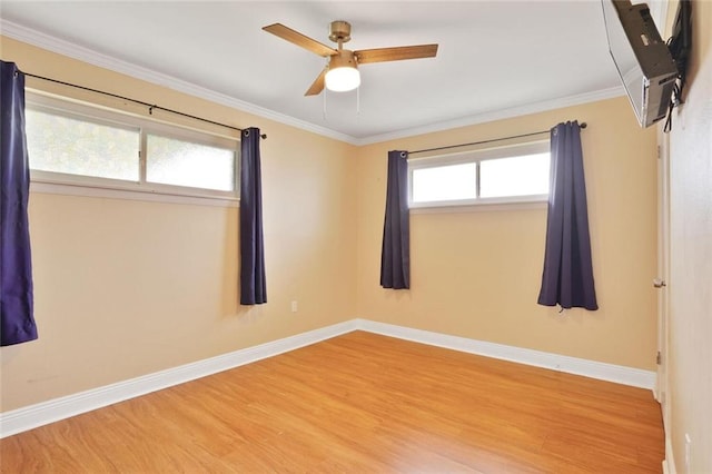 1517 Frankel Ave, Metairie, LA 70003 - empty room with wood finished floors, baseboards, a ceiling fan, and crown molding