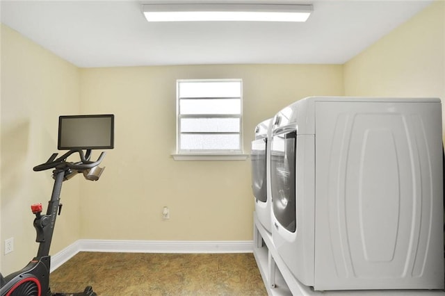 1517 Frankel Ave, Metairie, LA 70003 - laundry room with washer and clothes dryer and baseboards