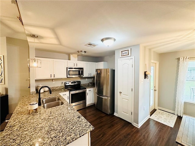 306 Allie Ln, Luling, LA 70070 - kitchen with stainless steel appliances, a sink, dark wood-style flooring, and white cabinetry