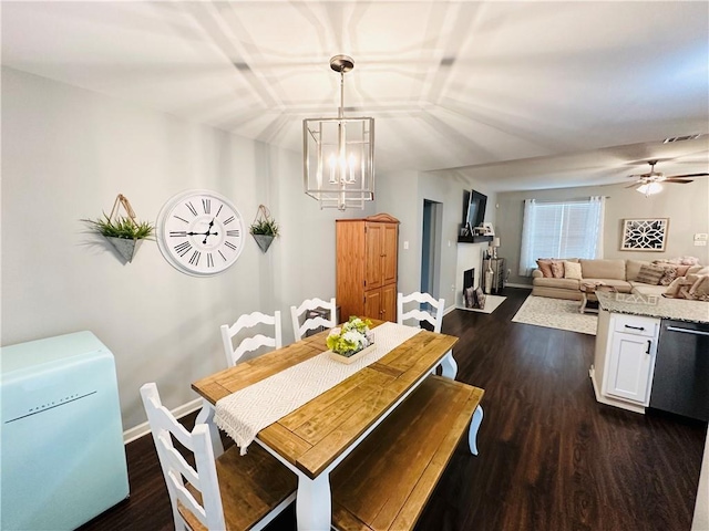 306 Allie Ln, Luling, LA 70070 - dining area featuring dark wood finished floors, a chandelier, baseboards, and ceiling fan