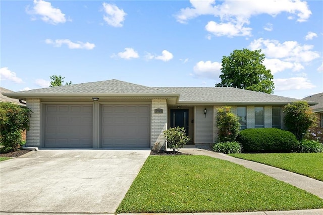 5705 Lafreniere St, Metairie, LA 70003 - single story home featuring brick siding, a garage, driveway, a front yard, and roof with shingles