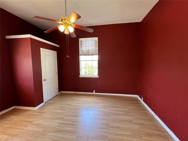 320 De Armas St, New Orleans, LA 70114 - spare room featuring ceiling fan, light wood-style flooring, a textured ceiling, and baseboards