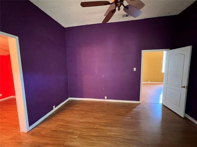 320 De Armas St, New Orleans, LA 70114 - empty room with wood finished floors, ceiling fan, and baseboards