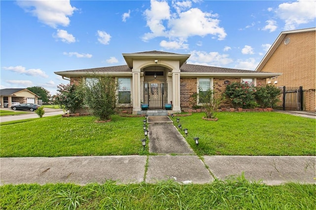 11276 Fernley Dr, New Orleans, LA 70128 - view of front of home with a gate and brick siding