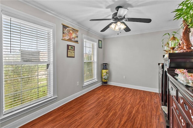 11276 Fernley Dr, New Orleans, LA 70128 - empty room with baseboards, dark wood-style floors, ornamental molding, and a ceiling fan