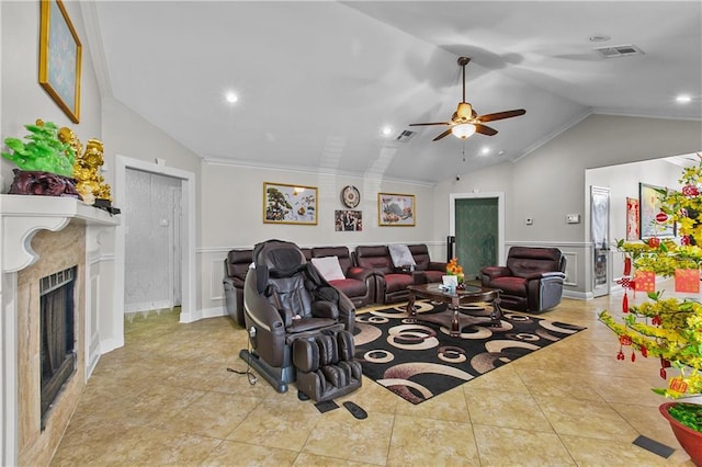 11276 Fernley Dr, New Orleans, LA 70128 - tiled living area with lofted ceiling, a ceiling fan, wainscoting, recessed lighting, and a premium fireplace