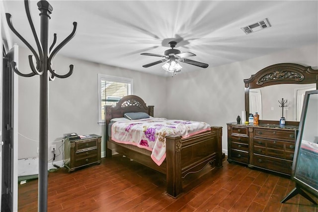 11276 Fernley Dr, New Orleans, LA 70128 - bedroom with dark wood finished floors, ceiling fan, and baseboards