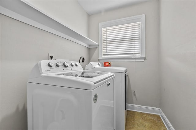11276 Fernley Dr, New Orleans, LA 70128 - washroom featuring washer and dryer and baseboards