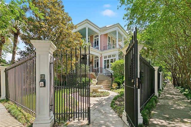 1633 Dufossat St, New Orleans, LA 70115 - view of front of home featuring a balcony, a gate, and a fenced front yard