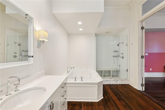 1633 Dufossat St, New Orleans, LA 70115 - full bathroom featuring a shower stall, wood-type flooring, a bath, vanity, and recessed lighting