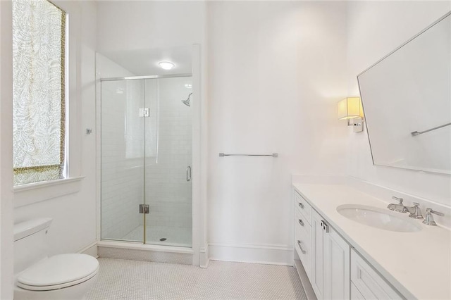 1633 Dufossat St, New Orleans, LA 70115 - full bath with vanity, a shower stall, tile patterned floors, toilet, and baseboards