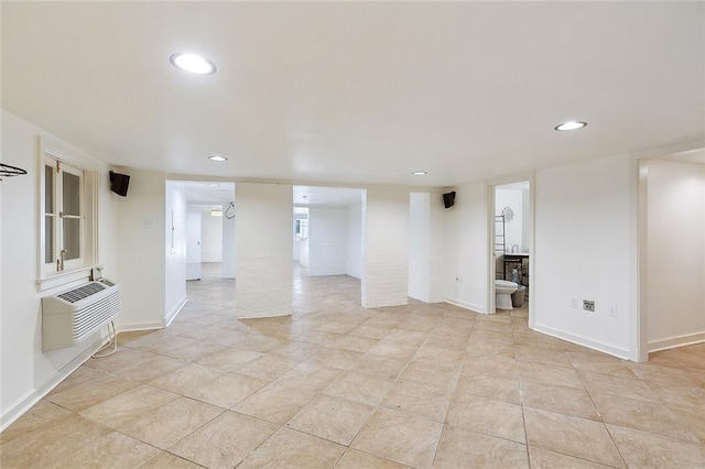 1633 Dufossat St, New Orleans, LA 70115 - unfurnished room with recessed lighting, light tile patterned floors, baseboards, and a wall mounted air conditioner
