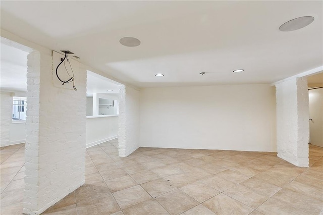 1633 Dufossat St, New Orleans, LA 70115 - empty room featuring ornate columns, recessed lighting, and light tile patterned flooring