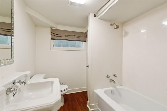 1633 Dufossat St, New Orleans, LA 70115 - full bath featuring a sink, toilet, wood finished floors,  shower combination, and baseboards