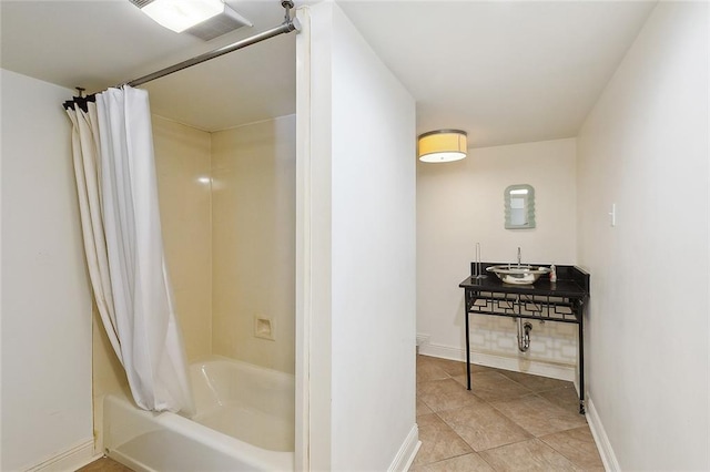1633 Dufossat St, New Orleans, LA 70115 - full bathroom featuring shower / bath combination with curtain, baseboards, toilet, a sink, and tile patterned flooring