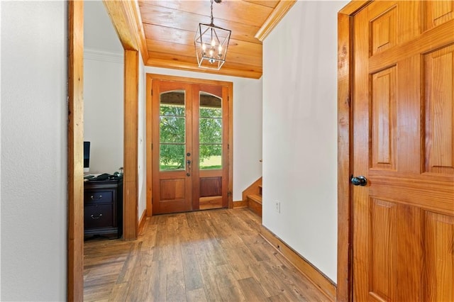 25766 La Highway 1032, Denham Springs, LA 70726 - entrance foyer featuring wooden ceiling, wood finished floors, a chandelier, stairway, and baseboards