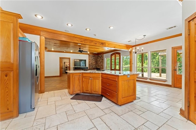 25766 La Highway 1032, Denham Springs, LA 70726 - kitchen featuring stainless steel fridge with ice dispenser, recessed lighting, open floor plan, stone tile flooring, and light countertops