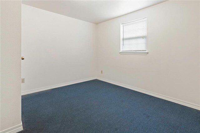 401 Oak Ave, Harahan, LA 70123 - empty room featuring dark colored carpet and baseboards