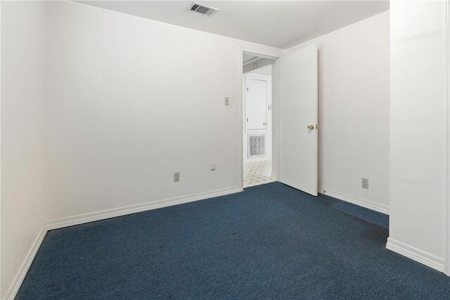 401 Oak Ave, Harahan, LA 70123 - unfurnished room with dark colored carpet and baseboards