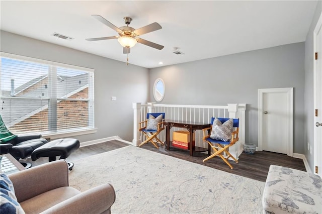 5405 Robeline Dr, Metairie, LA 70003 - living area with dark wood-style floors, ceiling fan, and baseboards