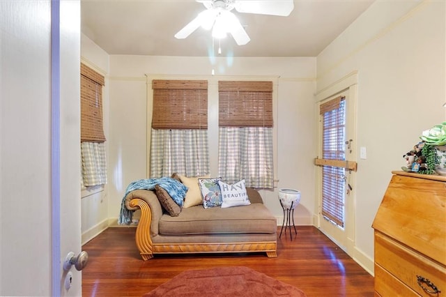 2622 Wisteria St, New Orleans, LA 70122 - living area with a ceiling fan, wood finished floors, and baseboards