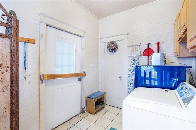 2622 Wisteria St, New Orleans, LA 70122 - washroom featuring cabinet space, light tile patterned floors, and separate washer and dryer