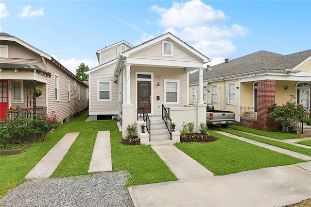3316 Calhoun St, New Orleans, LA 70125 - shotgun-style home with a front yard and covered porch