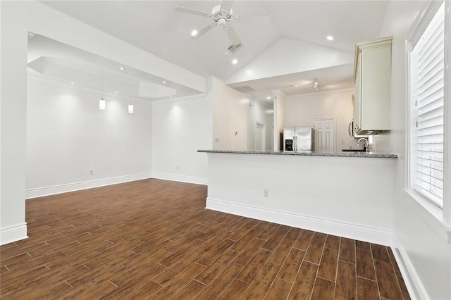 3316 Calhoun St, New Orleans, LA 70125 - unfurnished living room with ceiling fan, dark wood finished floors, baseboards, lofted ceiling, and recessed lighting