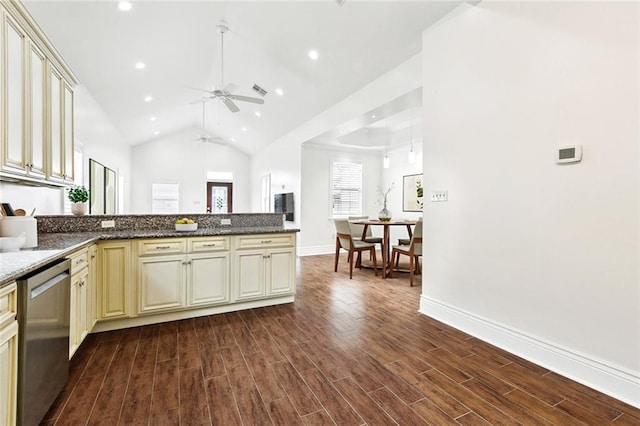 3316 Calhoun St, New Orleans, LA 70125 - kitchen with cream cabinetry, dishwasher, ceiling fan, dark wood finished floors, and vaulted ceiling
