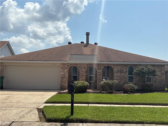 1705 Armagh Dr, Marrero, LA 70072 - view of front of home with a shingled roof, brick siding, an attached garage, and concrete driveway