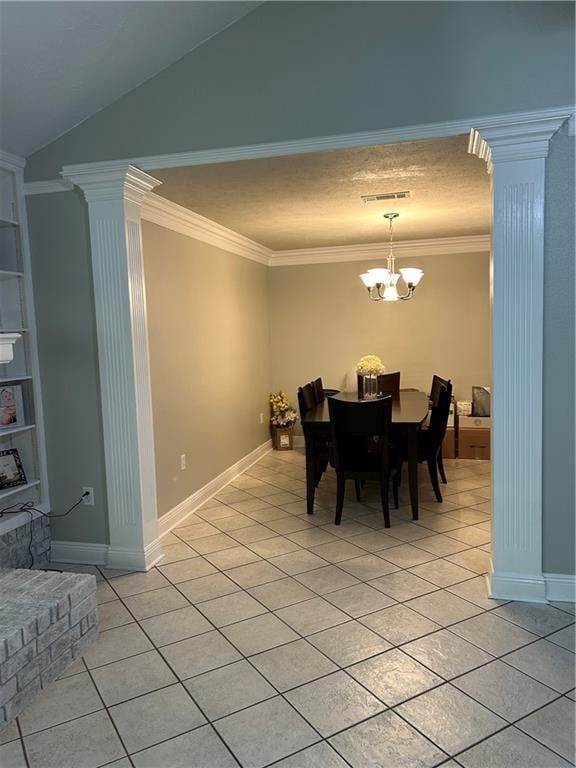1705 Armagh Dr, Marrero, LA 70072 - dining room featuring ornate columns, light tile patterned floors, crown molding, vaulted ceiling, and a chandelier