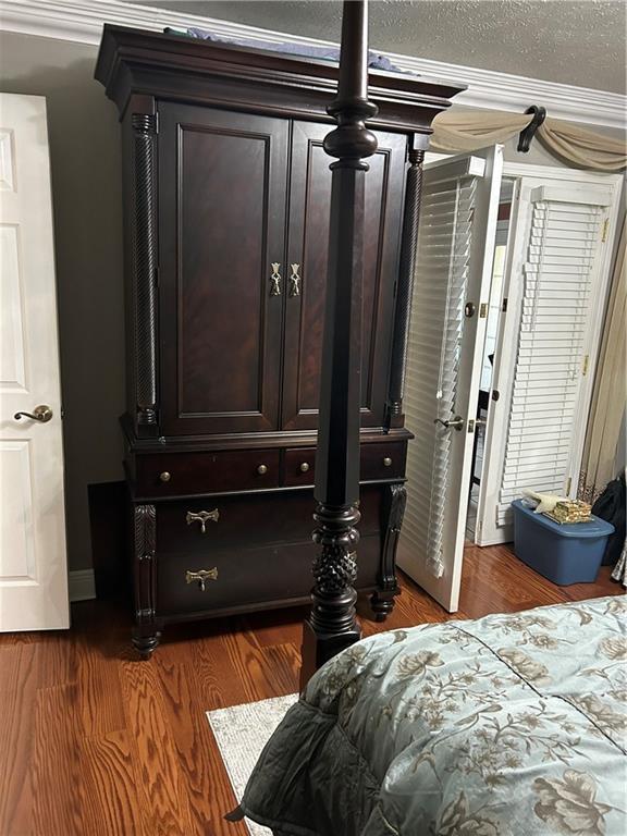 1705 Armagh Dr, Marrero, LA 70072 - bedroom featuring crown molding and wood finished floors