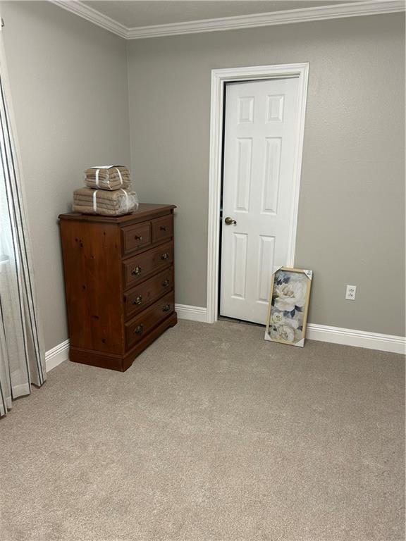 1705 Armagh Dr, Marrero, LA 70072 - bedroom with crown molding, light colored carpet, and baseboards