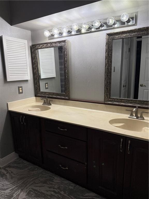 1705 Armagh Dr, Marrero, LA 70072 - bathroom with double vanity and baseboards