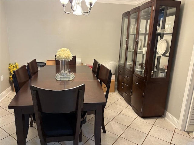 1705 Armagh Dr, Marrero, LA 70072 - dining room featuring a chandelier, light tile patterned floors, baseboards, and ornamental molding