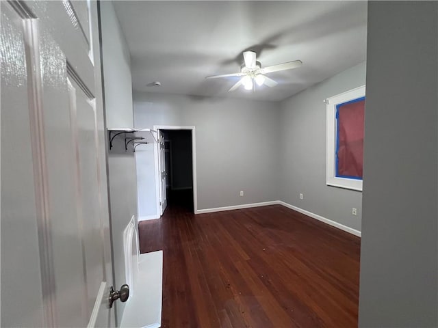 1133-35 Belleville St, New Orleans, LA 70114 - unfurnished bedroom featuring dark wood-style floors, baseboards, and ceiling fan