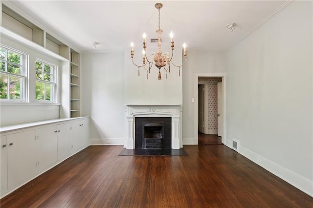 1665 Dufossat St, New Orleans, LA 70115 - unfurnished living room with dark wood-style floors, a chandelier, crown molding, a fireplace with flush hearth, and built in shelves